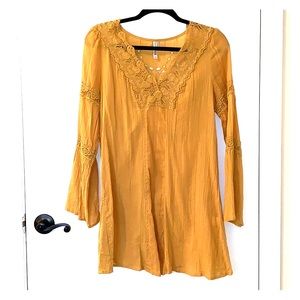 Mustard color, yellow tunic.
